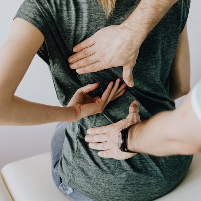 Doctor Examines Woman's back